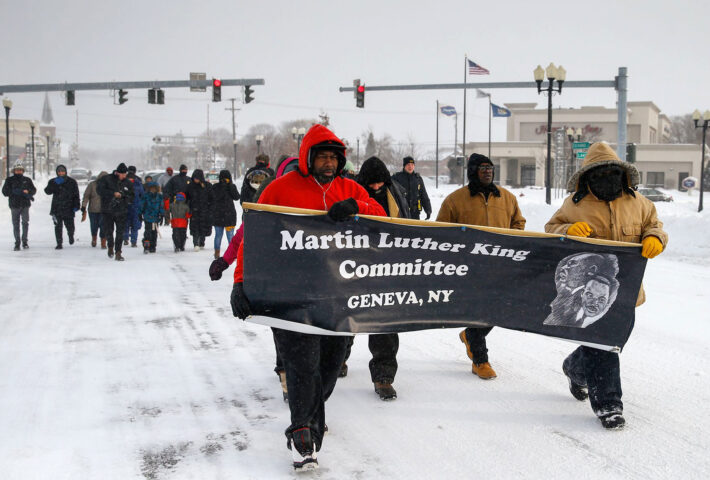 Martin Luther King Committee Marching with Banner